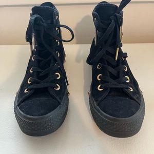 Black suede Converse in a size 7.5